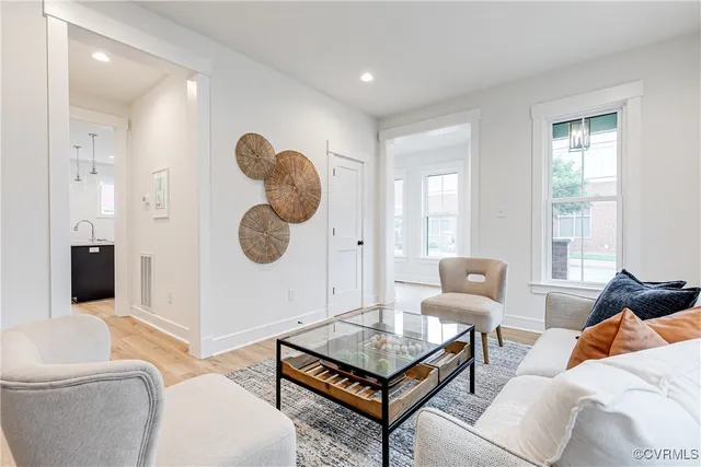 a living room with furniture and a window