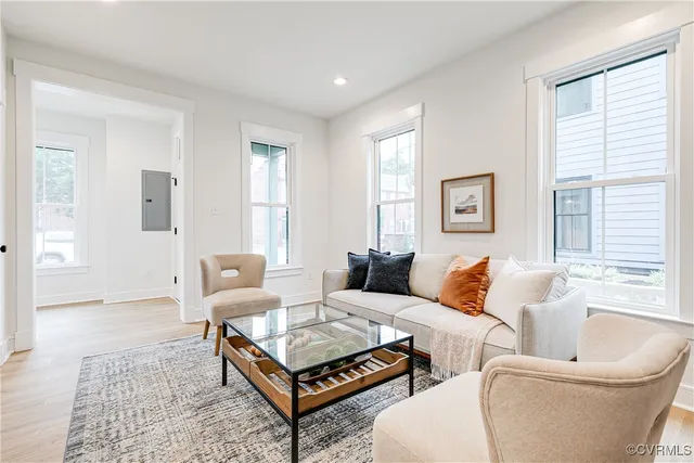 a living room with furniture and a large window
