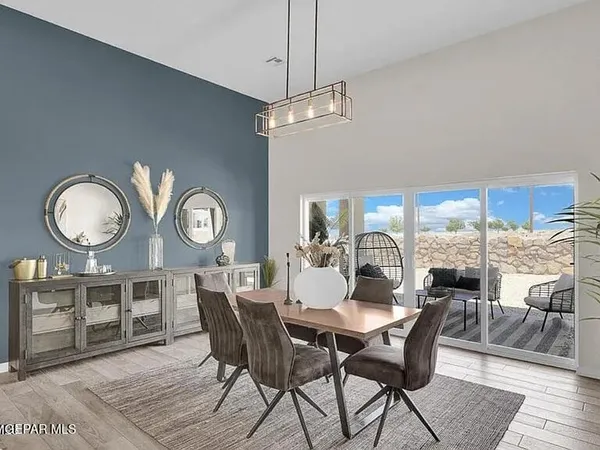 a view of a dining room with furniture window and wooden floor