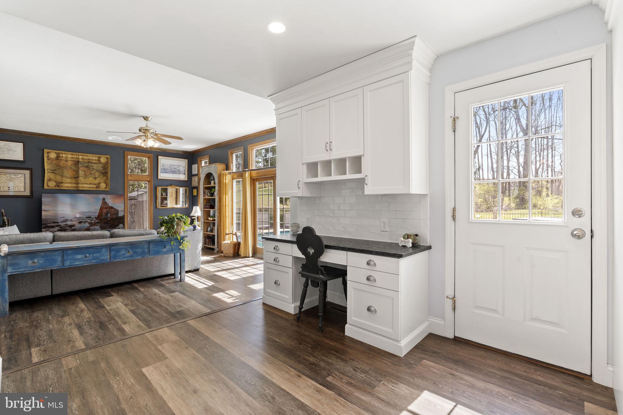1017 Scholl Road Pottstown, PA 19465 - Photo 13 of 56 a kitchen with stainless steel appliances wooden floor and a refrigerator