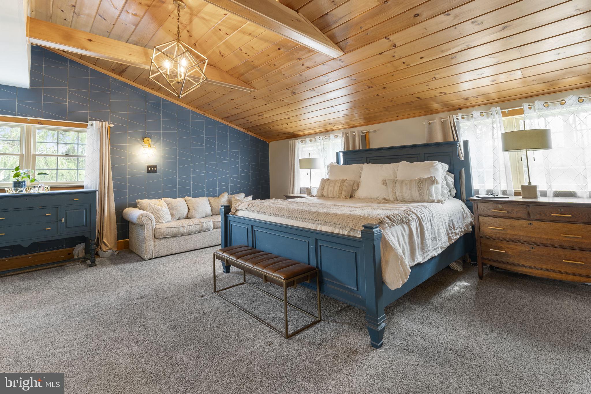 1017 Scholl Road Pottstown, PA 19465 - Photo 25 of 56 a bedroom with a bed and a chandelier