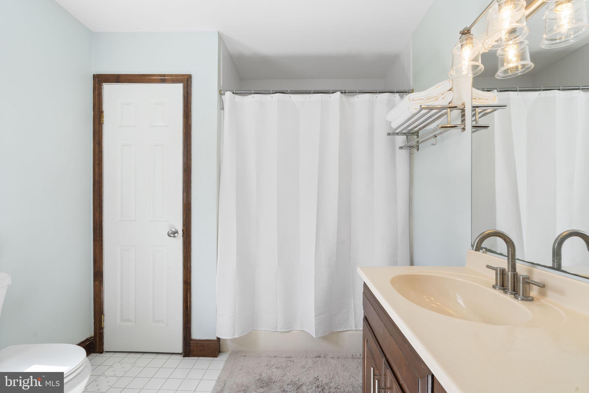 1017 Scholl Road Pottstown, PA 19465 - Photo 30 of 56 a bathroom with a sink and a mirror