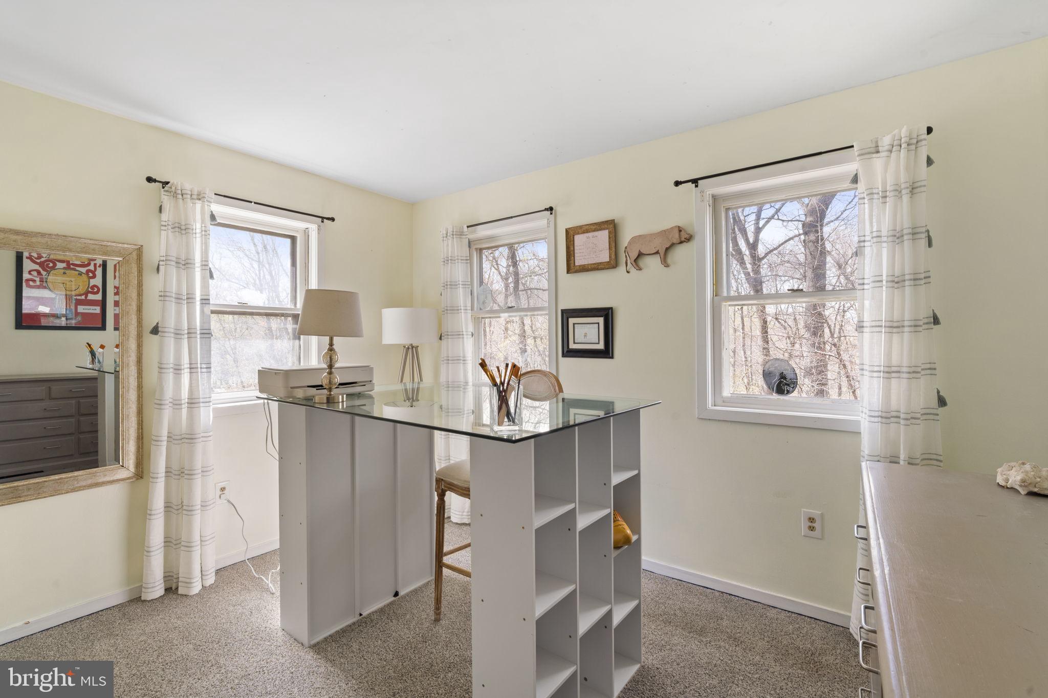 1017 Scholl Road Pottstown, PA 19465 - Photo 33 of 56 a living room with furniture a large window and kitchen view
