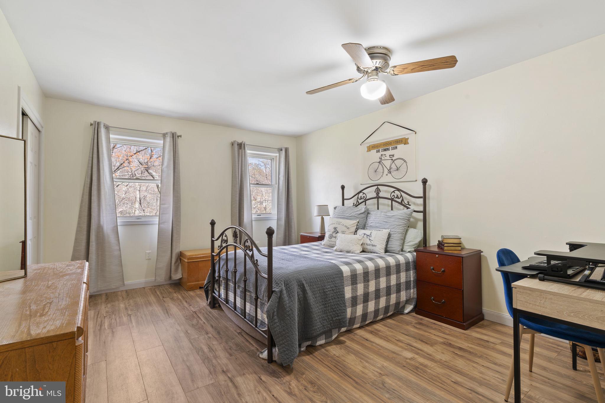 1017 Scholl Road Pottstown, PA 19465 - Photo 35 of 56 a bedroom with a bed wooden floor and window