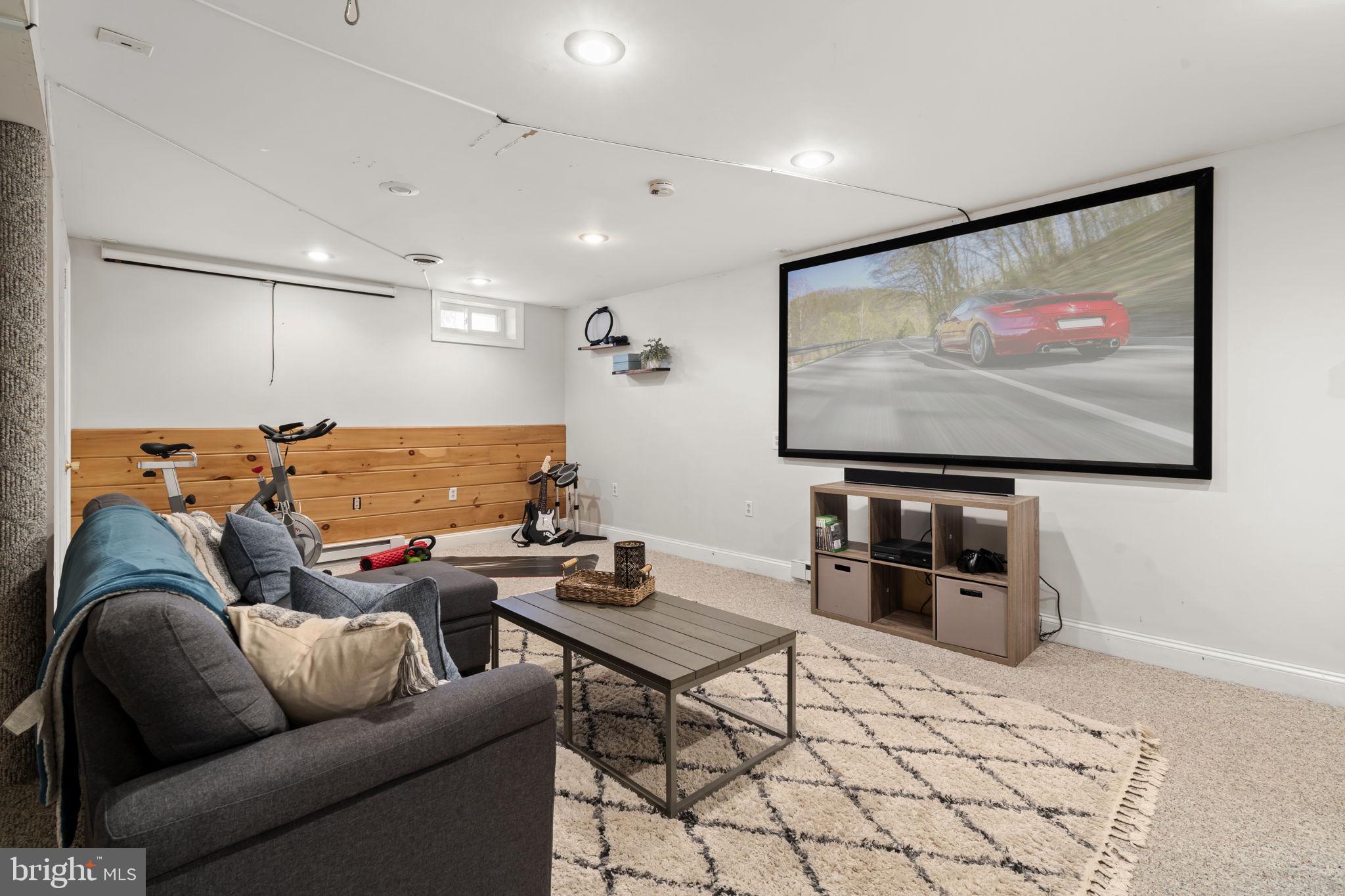 1017 Scholl Road Pottstown, PA 19465 - Photo 38 of 56 a living room with furniture and a flat screen tv