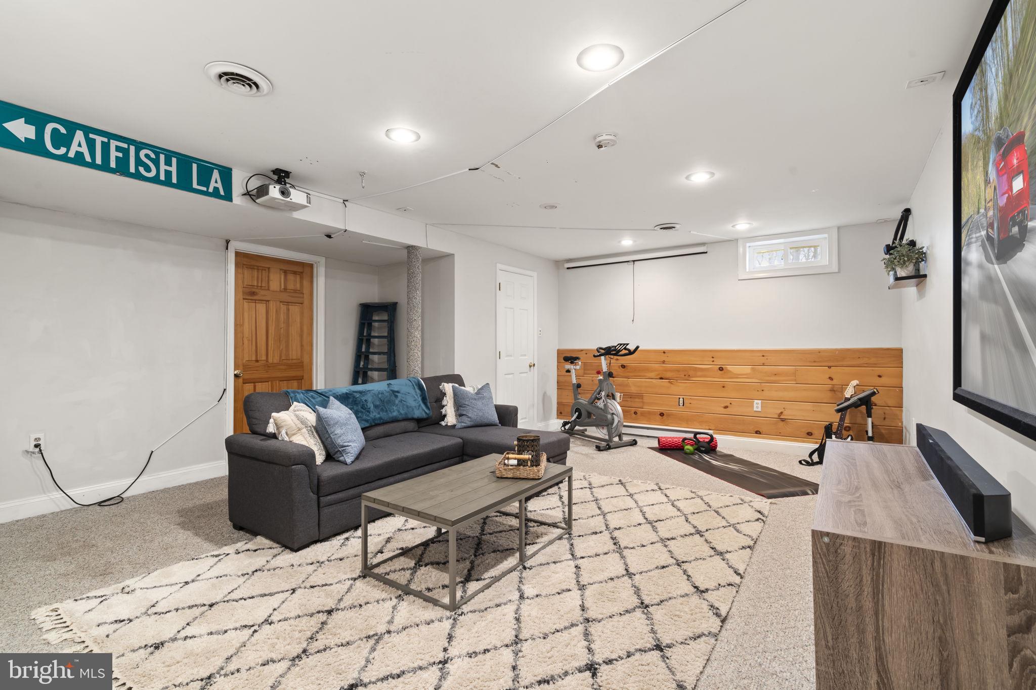 1017 Scholl Road Pottstown, PA 19465 - Photo 39 of 56 a living room with furniture and a flat screen tv