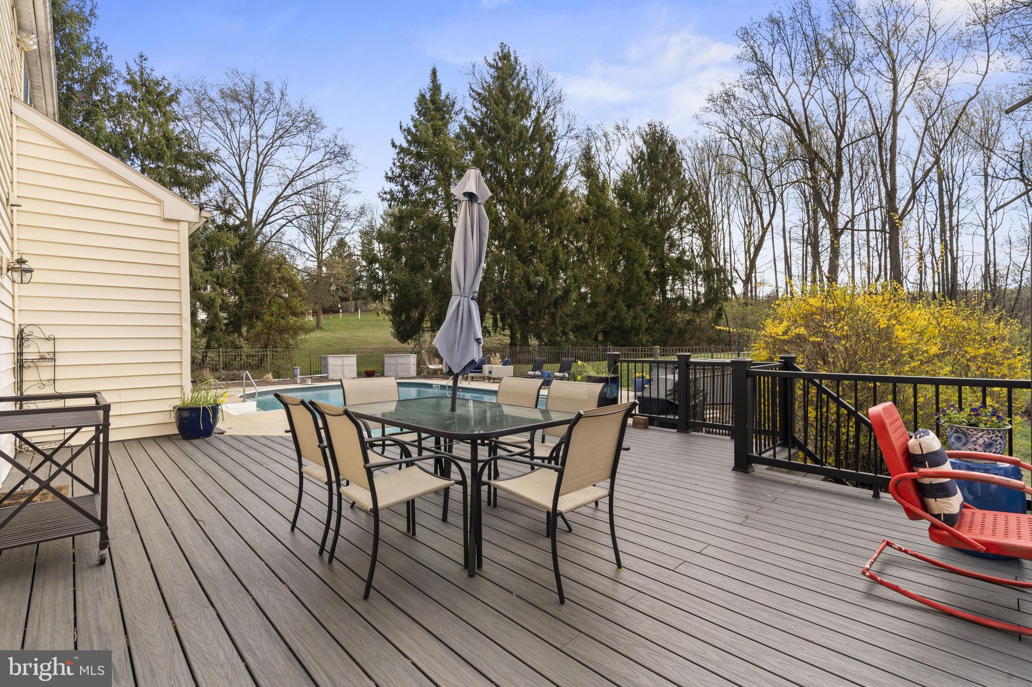 1017 Scholl Road Pottstown, PA 19465 - Photo 40 of 56 a view of a roof deck with table and chairs wooden floor and fence