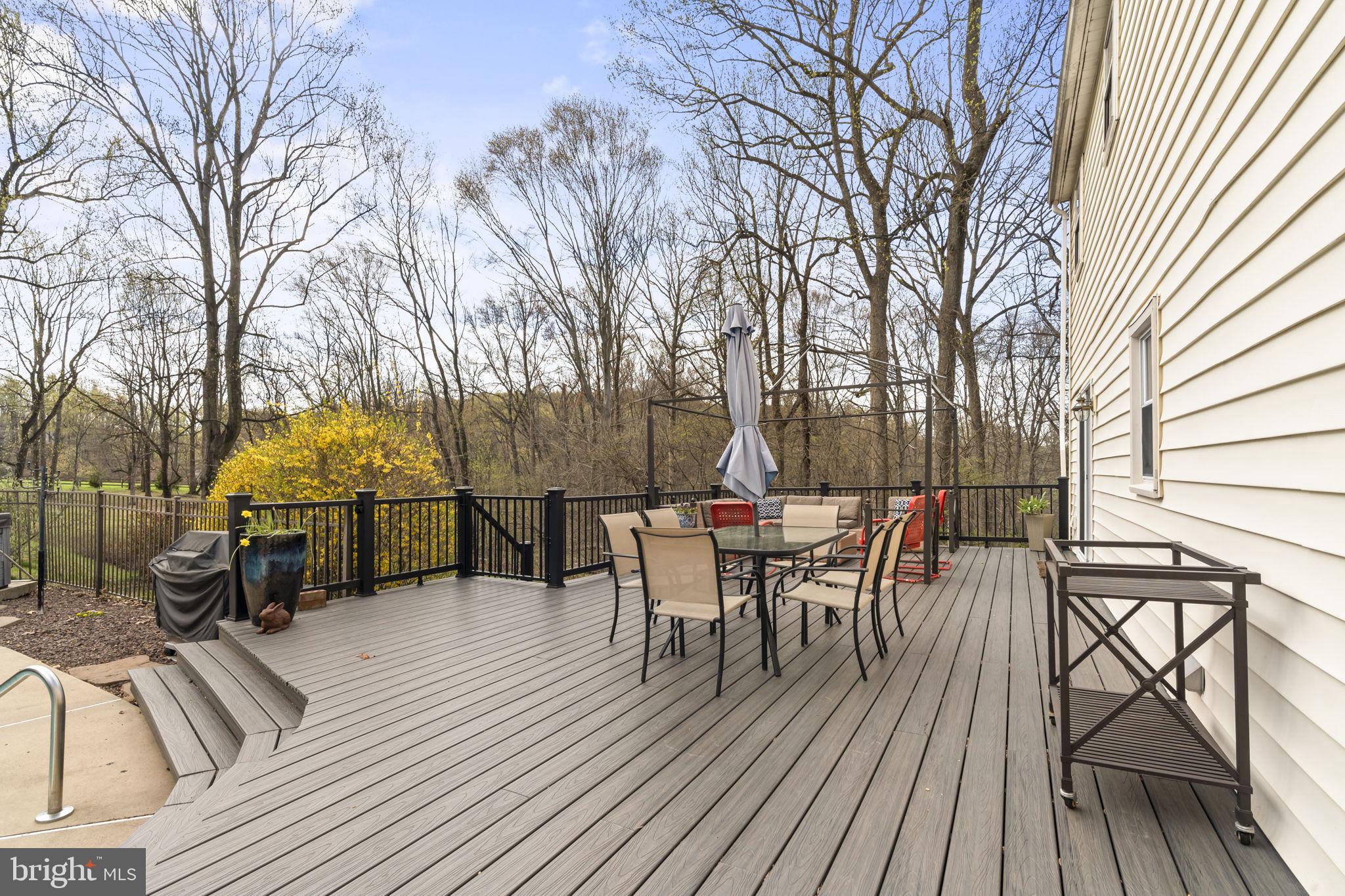 1017 Scholl Road Pottstown, PA 19465 - Photo 42 of 56 a view of a roof deck with table and chairs and wooden floor