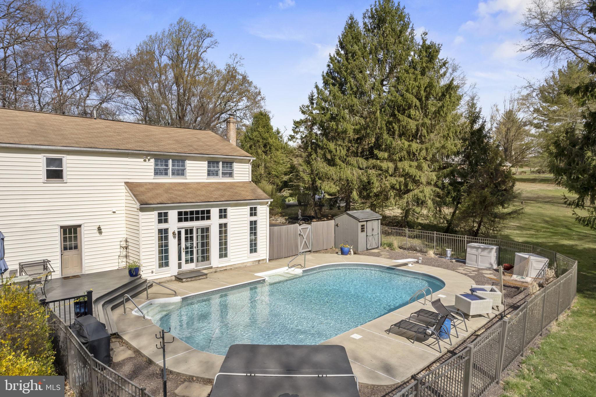1017 Scholl Road Pottstown, PA 19465 - Photo 45 of 56 a view of a house with pool and sitting area