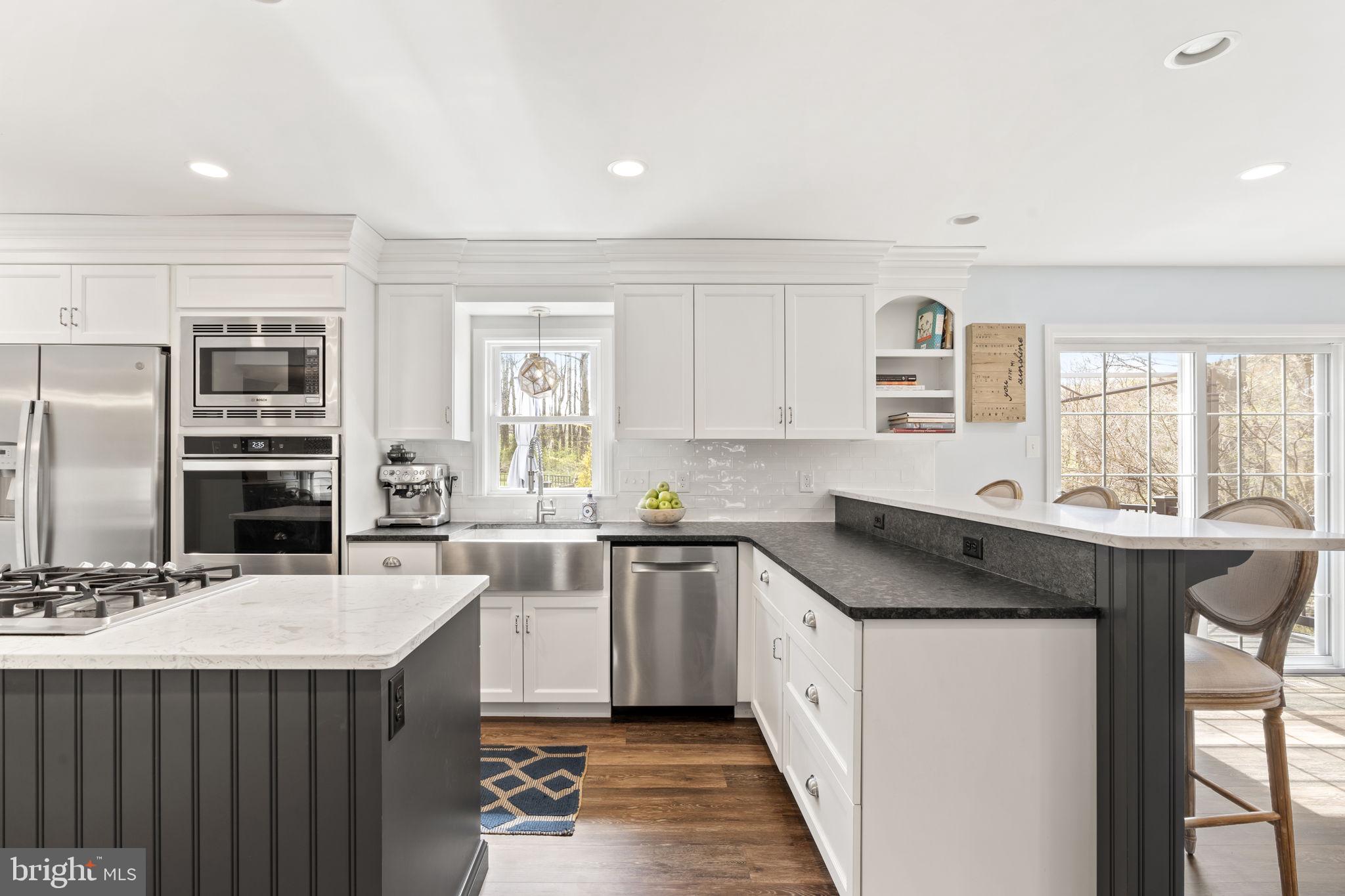 1017 Scholl Road Pottstown, PA 19465 - Photo 10 of 56 a kitchen with a sink stove and refrigerator