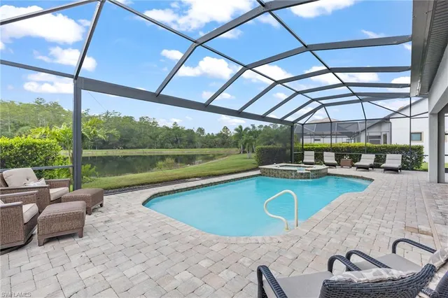 a view of a swimming pool with a patio