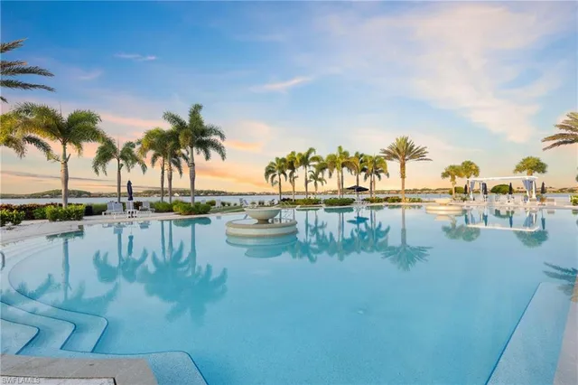 an aerial view of a house with a lake view