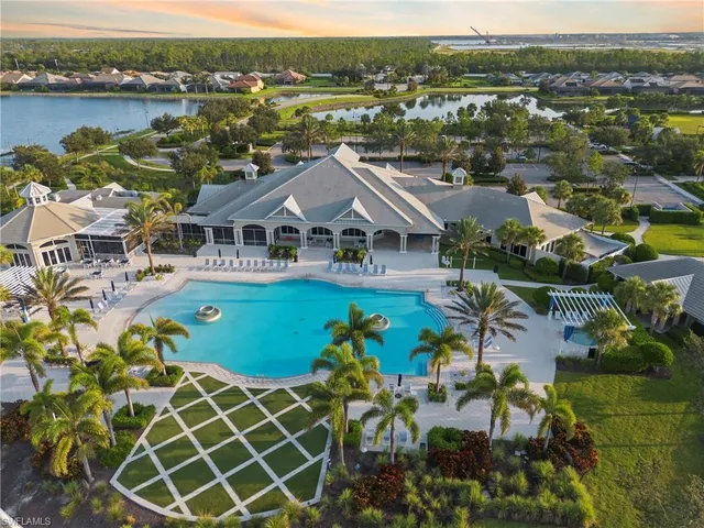 a view of a lake with a table and chairs