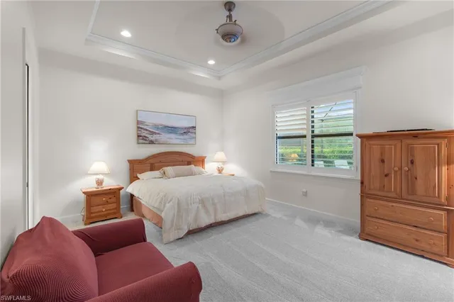 a bedroom with a bed and dresser