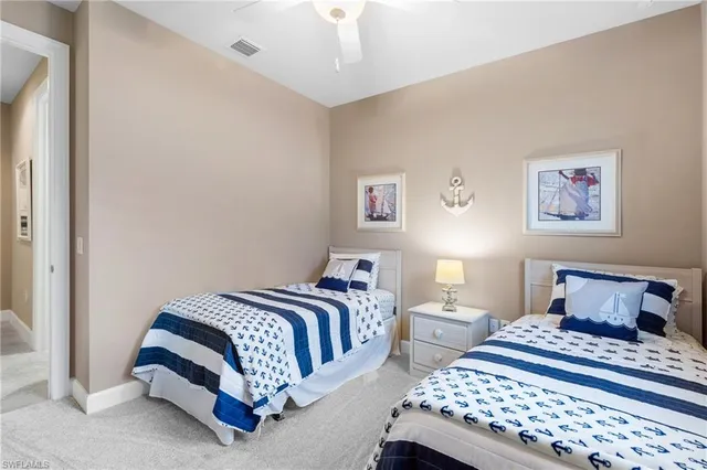 a bathroom with a granite countertop sink toilet a mirror and shower