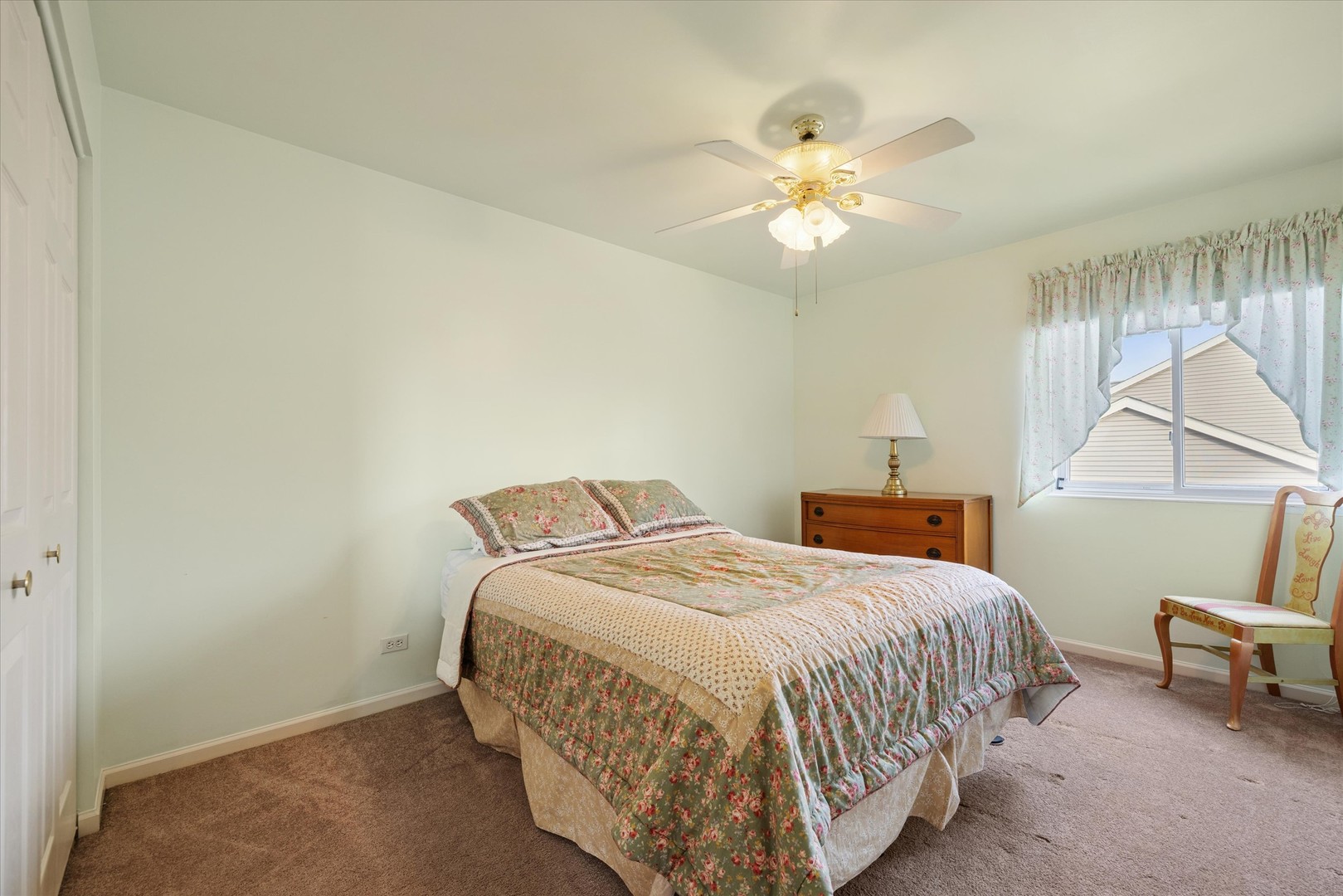 1157 Sawmill Lane Algonquin, IL 60102 - Photo 15 of 22 a bedroom with a bed and a chandelier