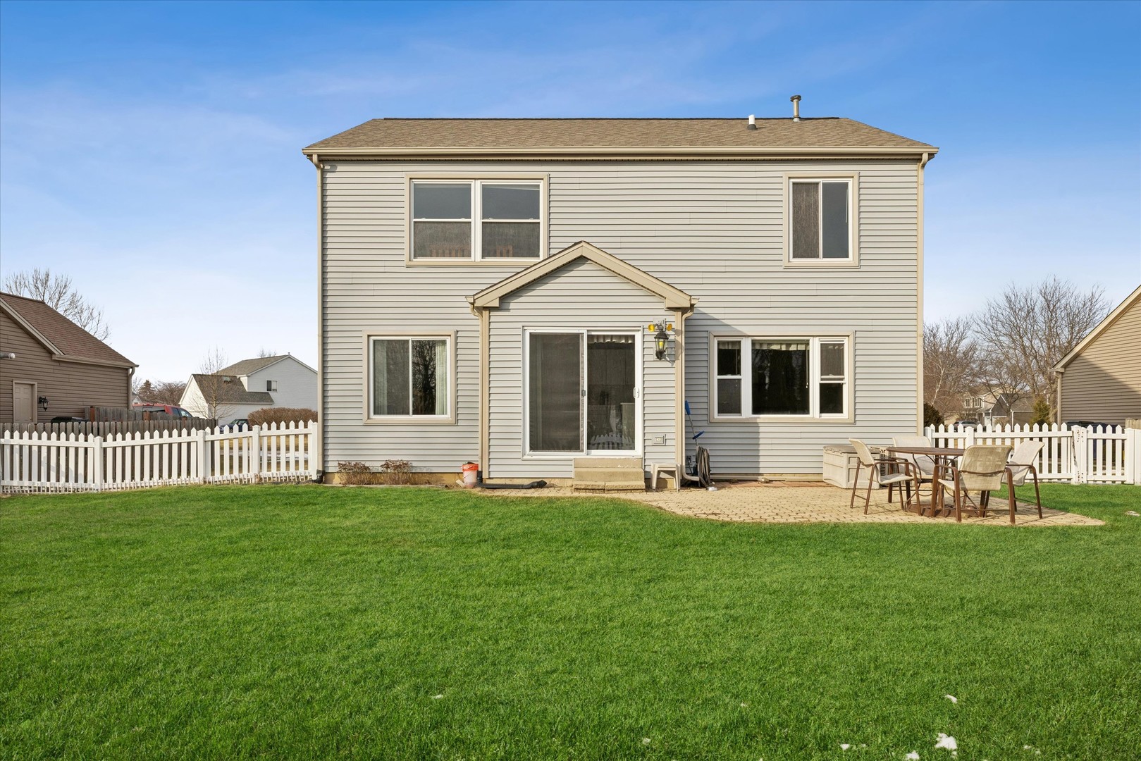1157 Sawmill Lane Algonquin, IL 60102 - Photo 18 of 22 a front view of a house with a yard and porch