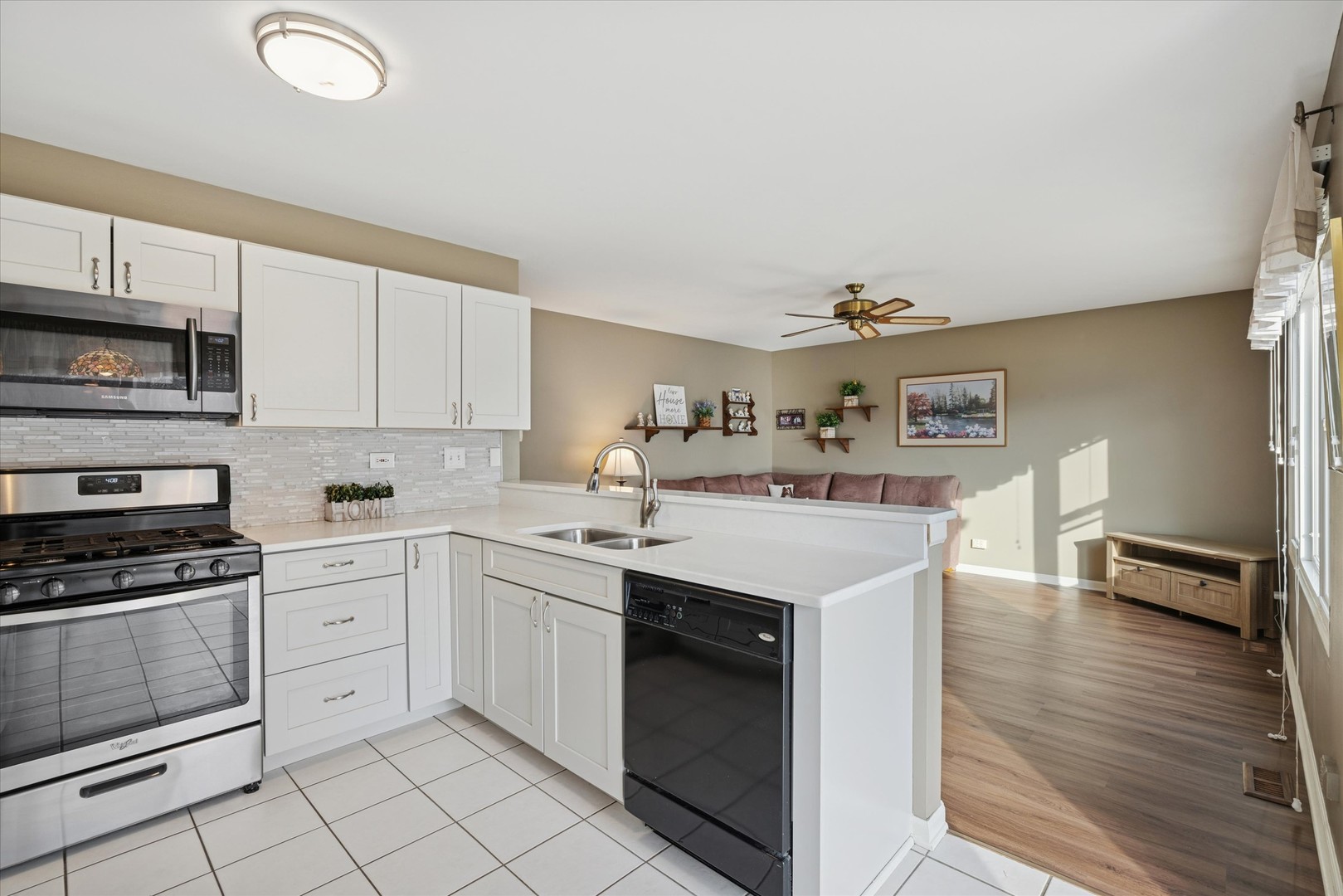 1157 Sawmill Lane Algonquin, IL 60102 - Photo 7 of 22 a kitchen with a sink cabinets and wooden floor