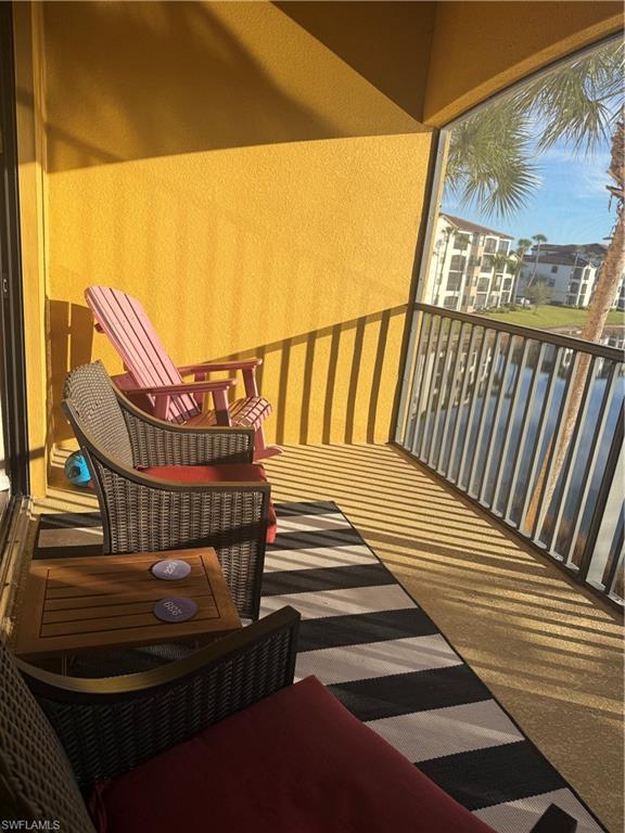 9566 Trevi Court, Unit 4935 Naples, FL 34113 - Photo 16 of 20 a view of outdoor space with deck and a patio