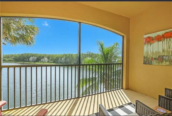 an aerial view of a house with a lake view