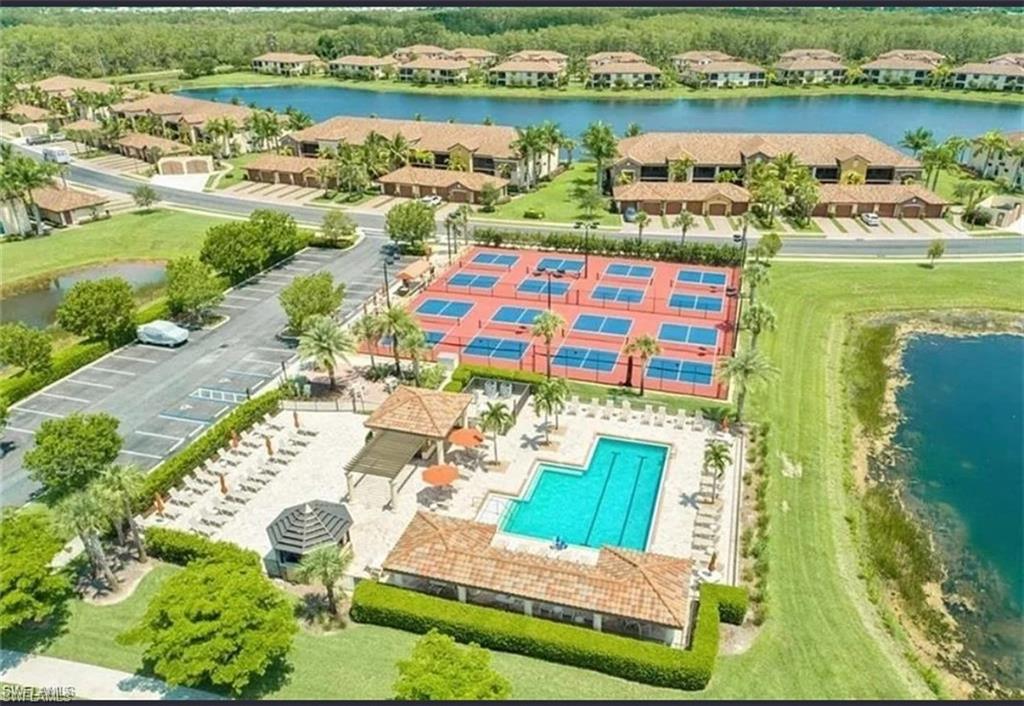 9566 Trevi Court, Unit 4935 Naples, FL 34113 - Photo 3 of 20 an aerial view of a house with a lake view