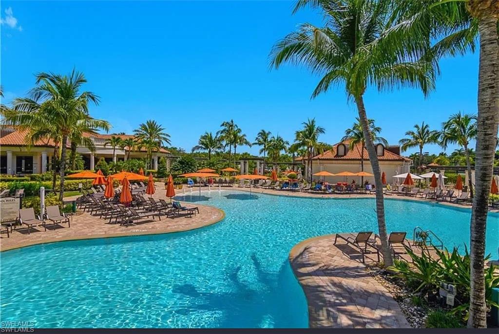 9566 Trevi Court, Unit 4935 Naples, FL 34113 - Photo 4 of 20 a view of a backyard and swimming pool
