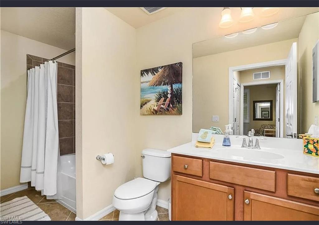 9566 Trevi Court, Unit 4935 Naples, FL 34113 - Photo 7 of 20 a bathroom with a sink toilet and shower