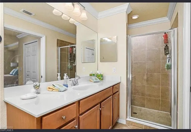 a bathroom with a granite countertop sink mirror and toilet