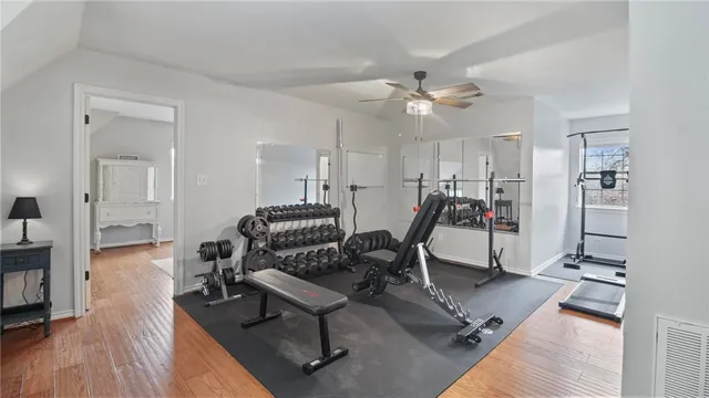 a view of a livingroom with furniture and a ceiling fan
