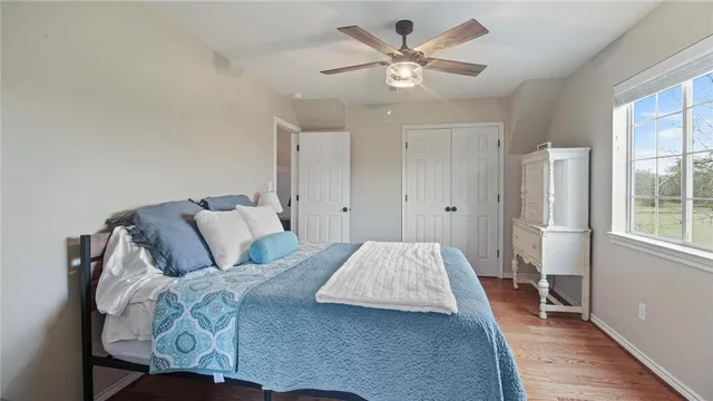 a bed room with a bed and a chandelier