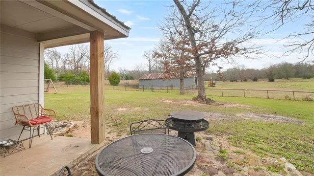 a view of a swimming pool with a lounge chair