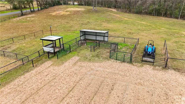 a view of a backyard with chairs