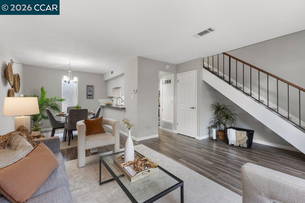 5468 Roundtree Drive, Unit C Concord, CA 94521 - Photo 13 of 27 a living room with furniture and a rug