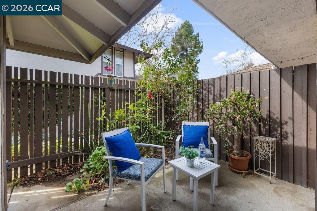 5468 Roundtree Drive, Unit C Concord, CA 94521 - Photo 15 of 27 a building outdoor space with patio furniture and potted plants