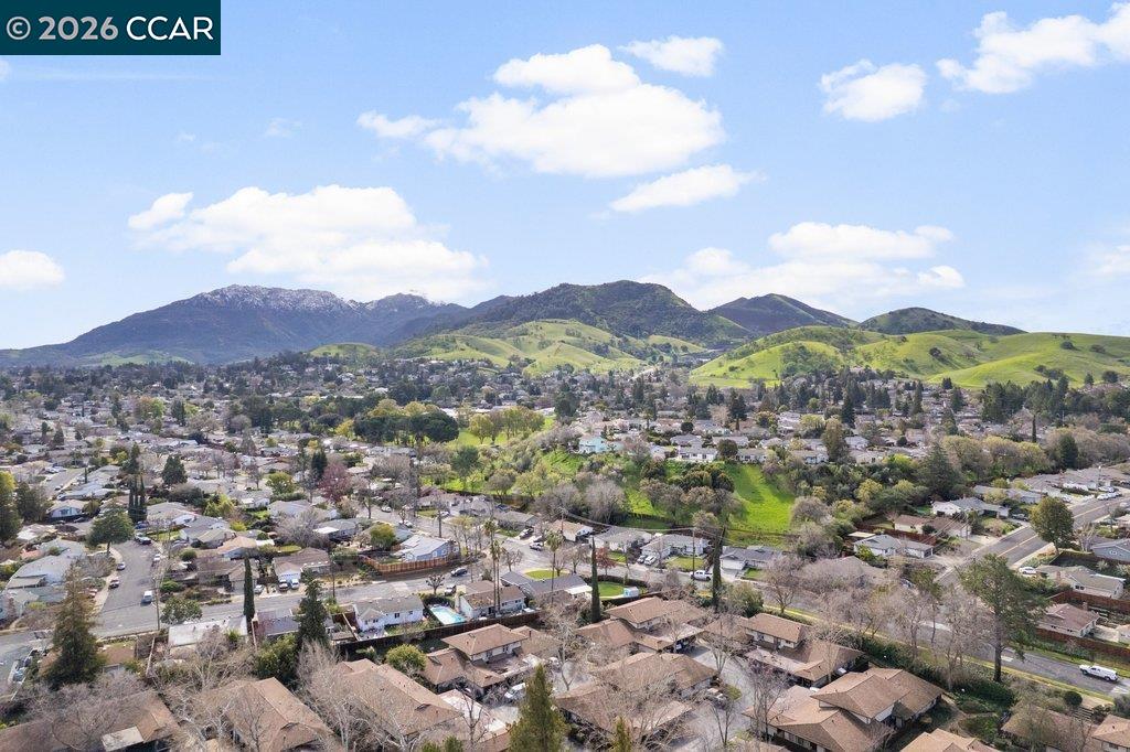 5468 Roundtree Drive, Unit C Concord, CA 94521 - Photo 27 of 27 a view of a city with mountain