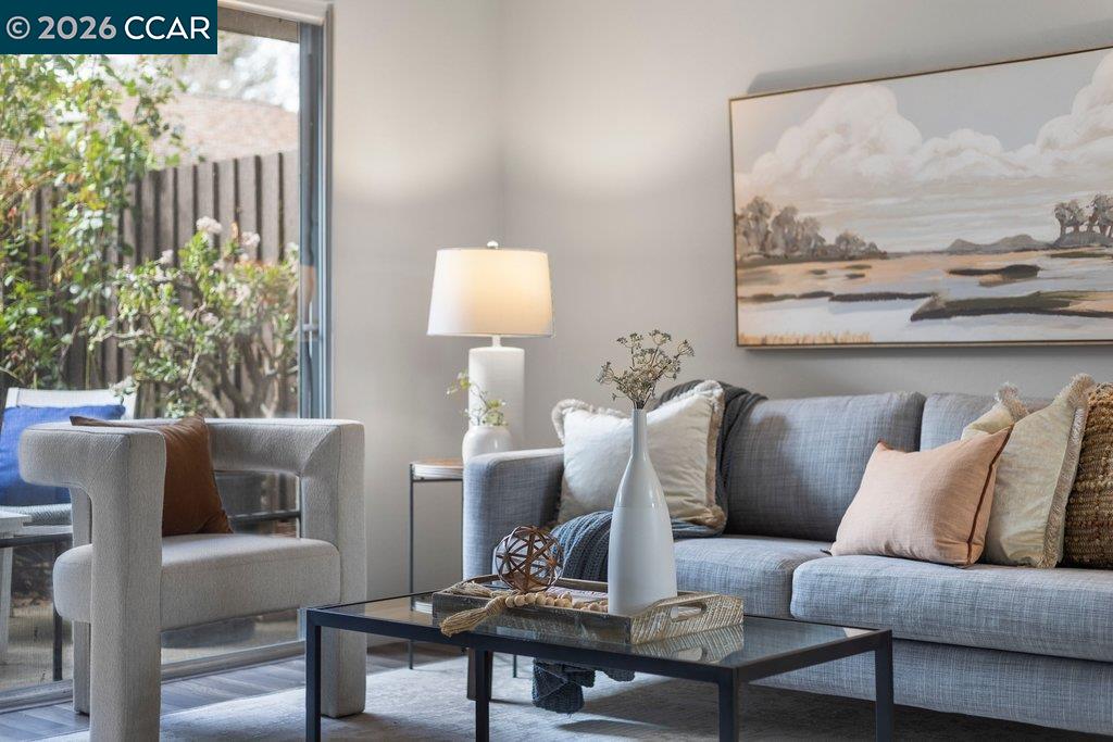 5468 Roundtree Drive, Unit C Concord, CA 94521 - Photo 4 of 27 a living room with furniture and a large window
