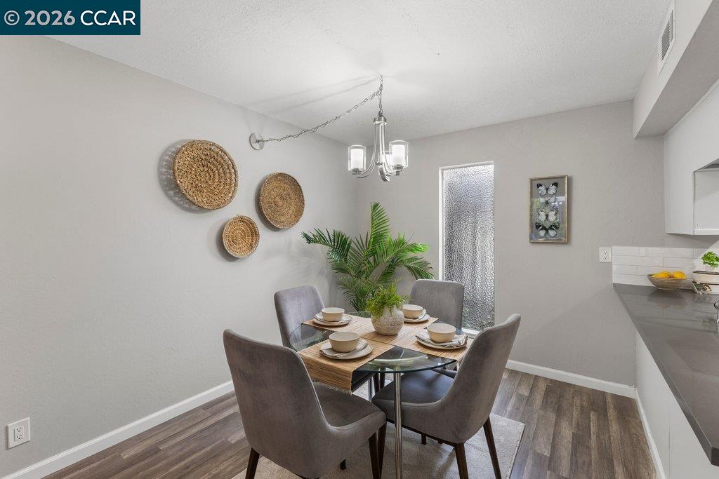 5468 Roundtree Drive, Unit C Concord, CA 94521 - Photo 10 of 27 a dining room with furniture and window