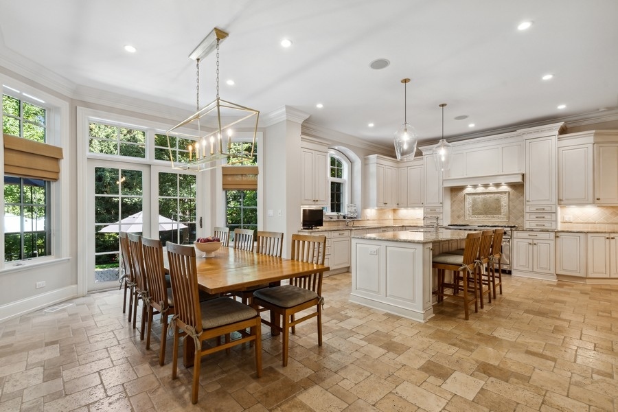 2239 Sheridan Road Highland Park, IL 60035 - Photo 11 of 46 a dining area with a table chairs and entryway