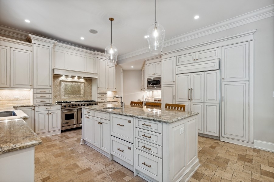 2239 Sheridan Road Highland Park, IL 60035 - Photo 14 of 46 a kitchen with stainless steel appliances granite countertop a stove oven and a refrigerator