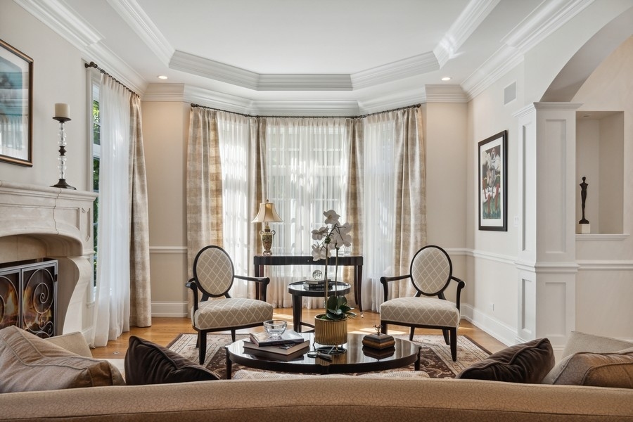 2239 Sheridan Road Highland Park, IL 60035 - Photo 18 of 46 a living room with fireplace furniture and floor to ceiling window