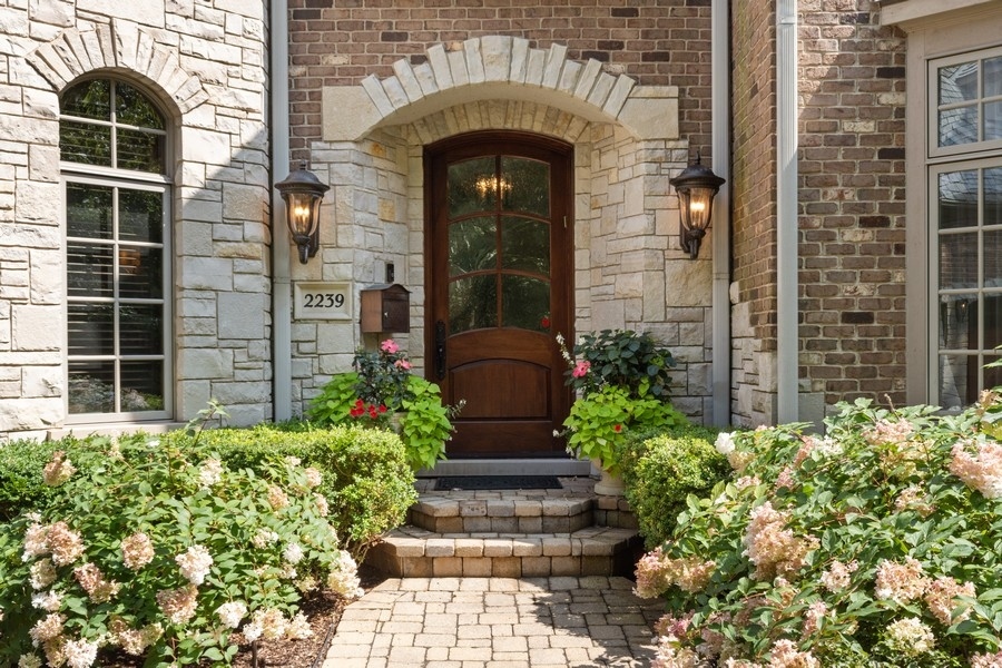 2239 Sheridan Road Highland Park, IL 60035 - Photo 2 of 46 a front view of a house with a yard