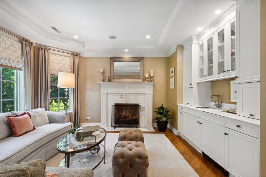 2239 Sheridan Road Highland Park, IL 60035 - Photo 24 of 46 a living room with furniture a fireplace and a floor to ceiling window