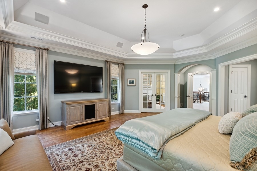 2239 Sheridan Road Highland Park, IL 60035 - Photo 26 of 46 a bedroom with a bed and a flat screen tv