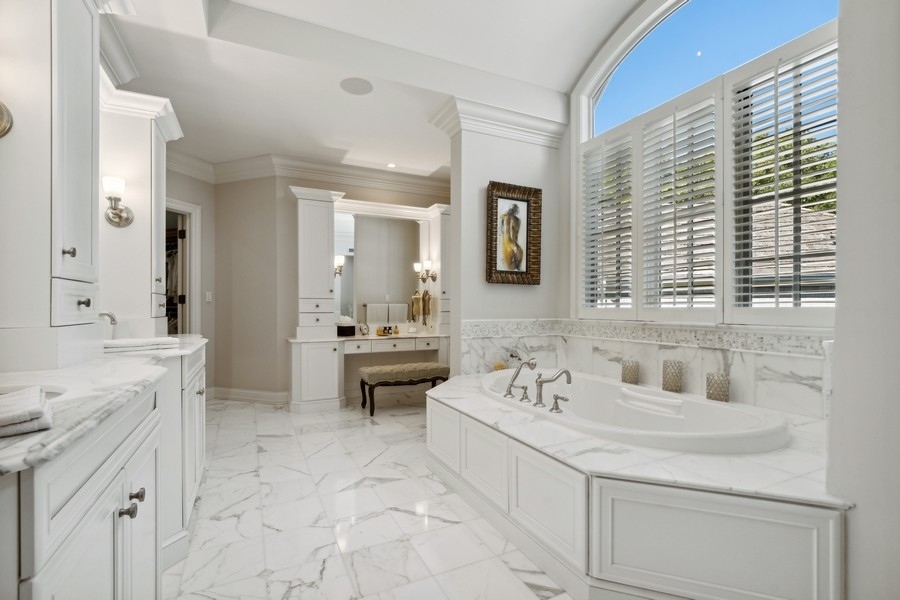 2239 Sheridan Road Highland Park, IL 60035 - Photo 27 of 46 a bathroom with a sink and a mirror