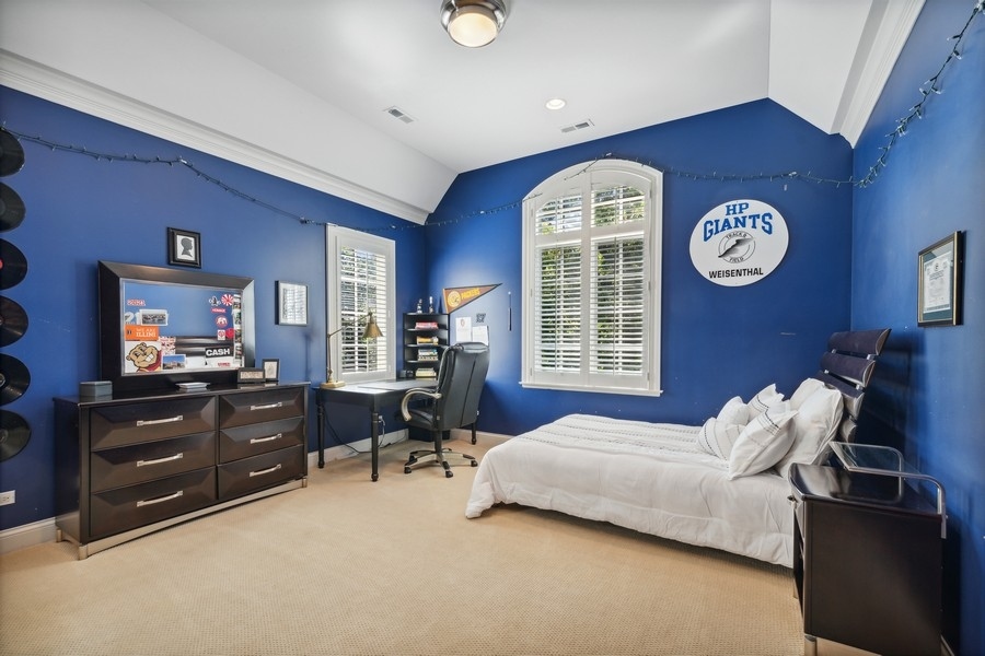 2239 Sheridan Road Highland Park, IL 60035 - Photo 31 of 46 a bedroom with a bed and a table in it