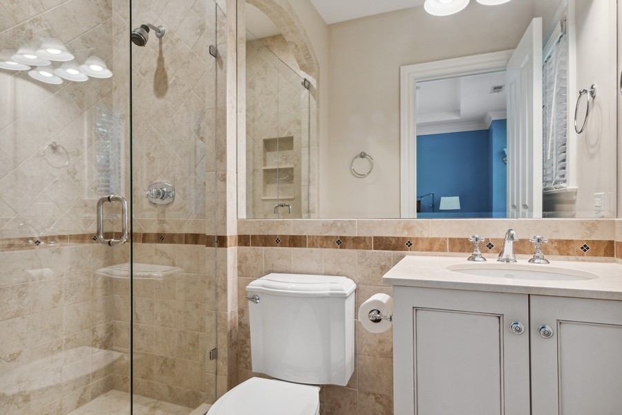 2239 Sheridan Road Highland Park, IL 60035 - Photo 34 of 46 a bathroom with a sink toilet vanity and shower
