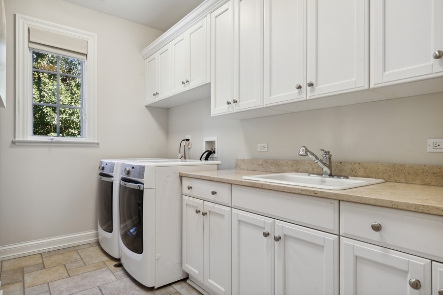 2239 Sheridan Road Highland Park, IL 60035 - Photo 35 of 46 a utility room with sink dryer and washer