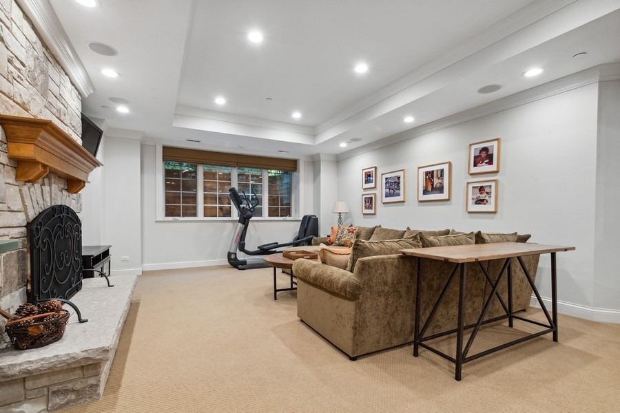2239 Sheridan Road Highland Park, IL 60035 - Photo 38 of 46 a living room with furniture a window and a fireplace