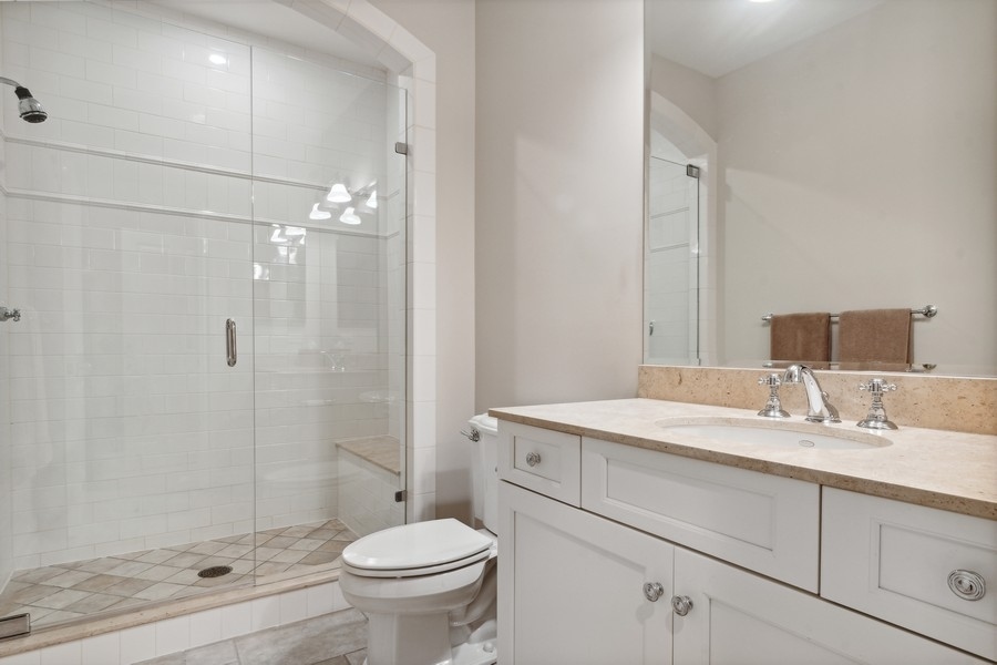 2239 Sheridan Road Highland Park, IL 60035 - Photo 41 of 46 a bathroom with a sink a toilet and shower