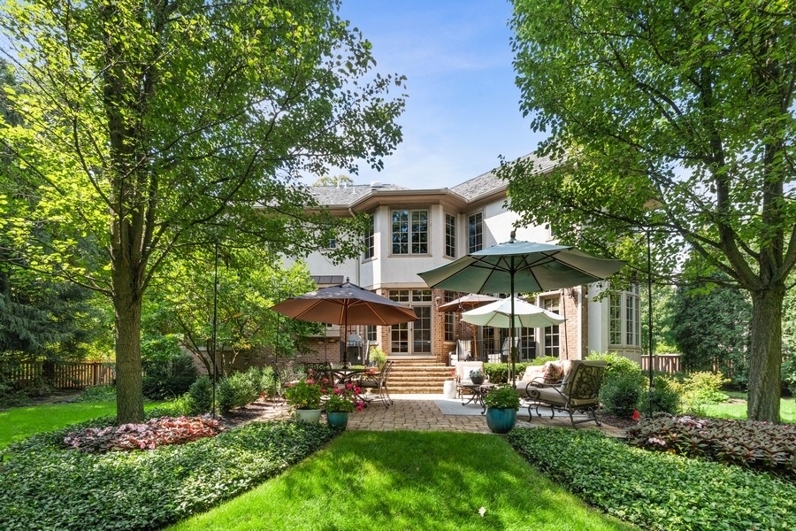2239 Sheridan Road Highland Park, IL 60035 - Photo 42 of 46 a front view of a house with garden and trees